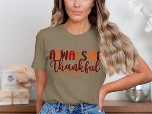 Brown t-shirt with "ALWAYS BE Thankful" text and autumn leaf graphics.