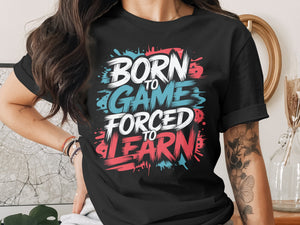 Black t-shirt with "Born to Game Forced to Learn" text graphic.