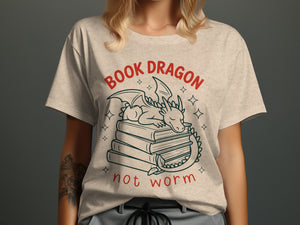 T-shirt with text "BOOK DRAGON not worm" and a sleeping dragon on books.