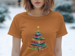 Orange t-shirt with a colorful abstract Christmas tree graphic and yellow star.