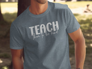 Charcoal t-shirt with "TEACH them to be kind" white text.
