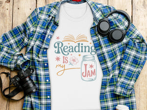 White t-shirt with "Reading is my Jam" graphic and plaid shirt.