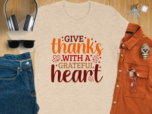 Beige t-shirt with "Give thanks with a grateful heart" text and fall leaves.