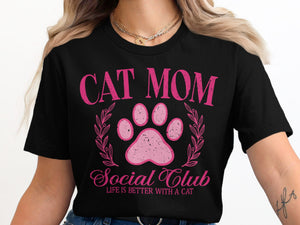 Black t-shirt with pink "Cat Mom Social Club" text and paw print design.