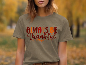 T-shirt with "Always Be Thankful" text and fall leaf accents.