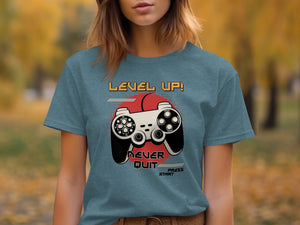 T-shirt with "LEVEL UP! NEVER QUIT PRESS START" text and a video game controller graphic.