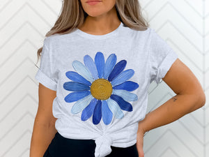 Gray t-shirt with a large, textured blue daisy graphic and a knotted hem.