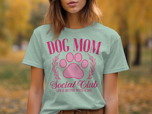 Light mint t-shirt with pink text "DOG MOM Social Club LIFE IS BETTER WITH A DOG".