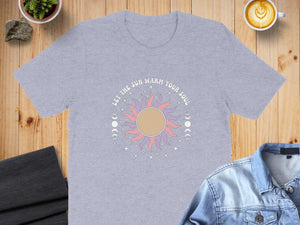 Gray t-shirt with a large sun graphic and text "LET THE SUN WARM YOUR SOUL".