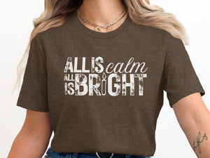 Brown t-shirt with distressed white text "All is Calm All is Bright".