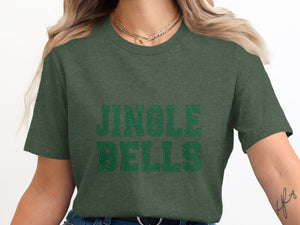 Green t-shirt with distressed "JINGLE BELLS" text in a collegiate font.