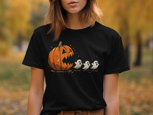 Black t-shirt with a graphic of a jack-o'-lantern chasing three small ghosts.