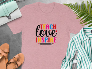 Pink t-shirt with "Teach Love Inspire" text and a pencil graphic.