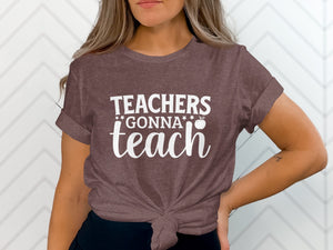 Brown t-shirt with white text "TEACHERS GONNA teach" and an apple.
