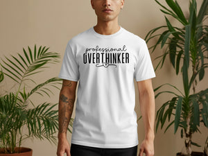 White t-shirt with black text reading "professional OVERTHINKER" and a heart.