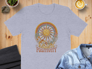 Grey t-shirt with retro sun design and text "RADIATE POSITIVITY".