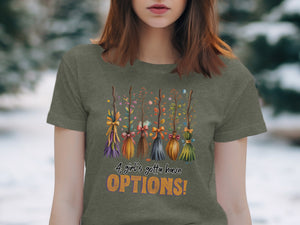 T-shirt with five decorative brooms and text "A girl's gotta have OPTIONS!".