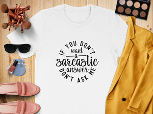 White t-shirt with "If you don't want a sarcastic answer don't ask me" text.