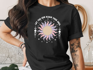 Black t-shirt with "LET THE SUN WARM YOUR SOUL" text and boho sun graphic.