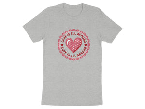 Grey t-shirt with a pink circular design featuring a polka dot heart and "Love Is All Around".