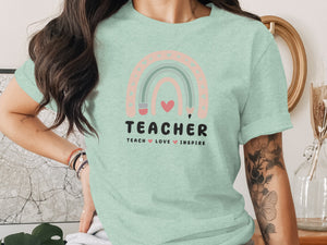 Mint green t-shirt with pastel rainbow graphic and "TEACHER" text.