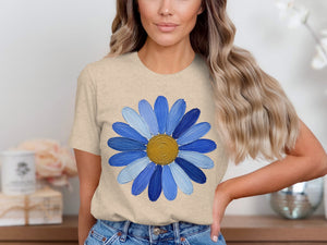 T-shirt with blue and white daisy graphic and textured brush strokes.