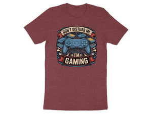 Maroon t-shirt featuring a design with a game controller, game cartridges, and text.