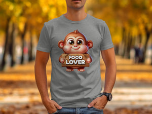 Grey t-shirt showing a cartoon monkey holding a "FOOD LOVER" sign.