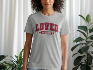 Grey t-shirt with distressed red text "LOVED TEACHER" and heart accents.