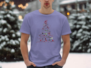 Purple t-shirt with a whimsical Christmas tree graphic and a snowy background.