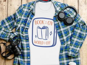 White t-shirt with blue and orange graphic: "BOOK: ON WORLD: OFF"