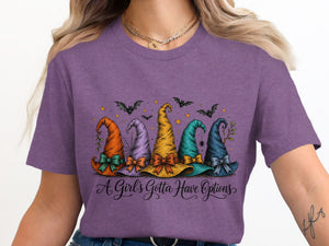 Five colorful witch hats with bows and Halloween accents, with text "A Girl's Gotta Have Options".