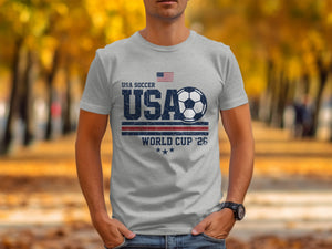 Grey t-shirt with USA Soccer World Cup '26 graphic and American flag.