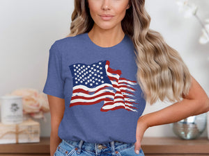 Woman wearing a blue t-shirt with a distressed American flag graphic.