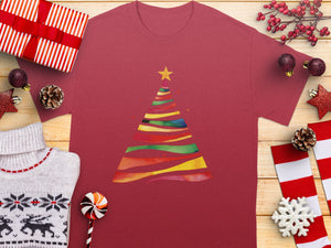 Maroon t-shirt with a colorful watercolor Christmas tree design and yellow star.