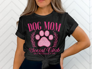 Black t-shirt with pink text reading "Dog Mom Social Club Life is Better With a Dog".