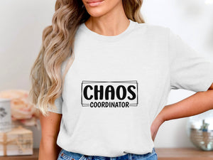 White t-shirt with "CHAOS COORDINATOR" text in a black rectangle and border.