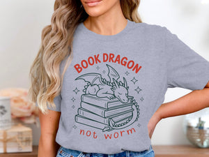 Grey t-shirt with a dragon sleeping on a stack of books, reading "BOOK DRAGON not worm."