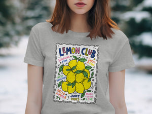 Grey t-shirt with "Lemon Club" text and illustration of lemons and summer vibes.