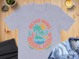Light grey t-shirt with "Beach More Worry Less" graphic featuring palm trees and ocean scene.