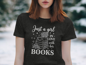 Dark t-shirt with white text "Just a girl IN LOVE with her BOOKS" and illustrations.