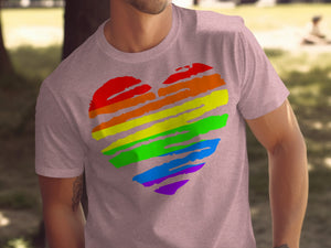 Pink t-shirt with a rainbow-striped heart graphic.