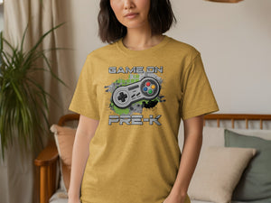 Yellow t-shirt with "GAME ON PRE-K" text and a video game controller graphic.