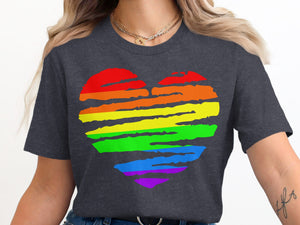 Dark gray t-shirt with a rainbow heart graphic and two gold necklaces.