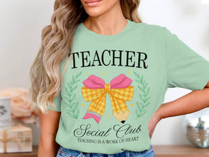 Light green t-shirt with "TEACHER Social Club" and pencil-bow graphic.