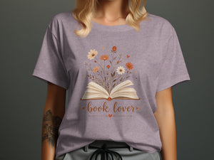 T-shirt design features an open book with flowers and the text "book lover."