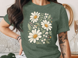 Green t-shirt with a white daisy and floral arrangement graphic.