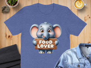 Cute elephant holding a "FOOD LOVER" sign on a blue t-shirt.