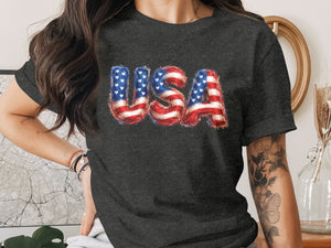 Dark grey t-shirt with "USA" printed in patriotic, balloon-like letters.