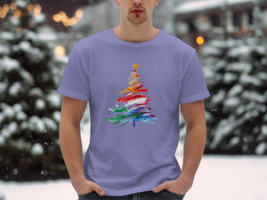T-shirt with abstract colorful Christmas tree graphic on a man outdoors.